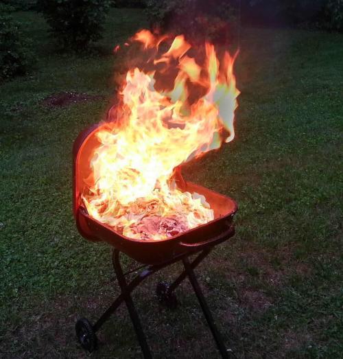 A grill with enourmous flames